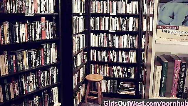 Nerdy hairy girls make out between the bookshelves