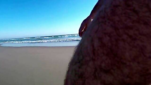 Nude Male Talk on a Clothed Beach