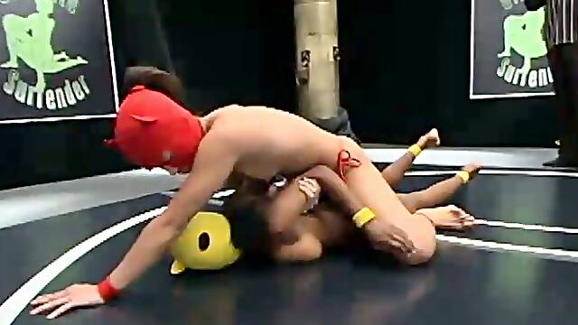 Two masked girls fight on tatami and have doggy style sex with a strapon